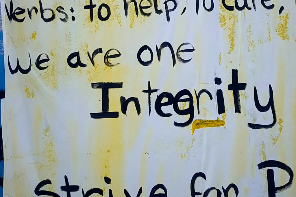 A poster saying: "we are one integrity"
