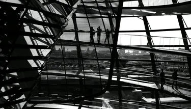 Black and white image of people standing in the Reichstag building in Berlin
