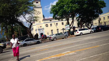 Woman crossing the street in front of Mutare Criminal Magistrates Court